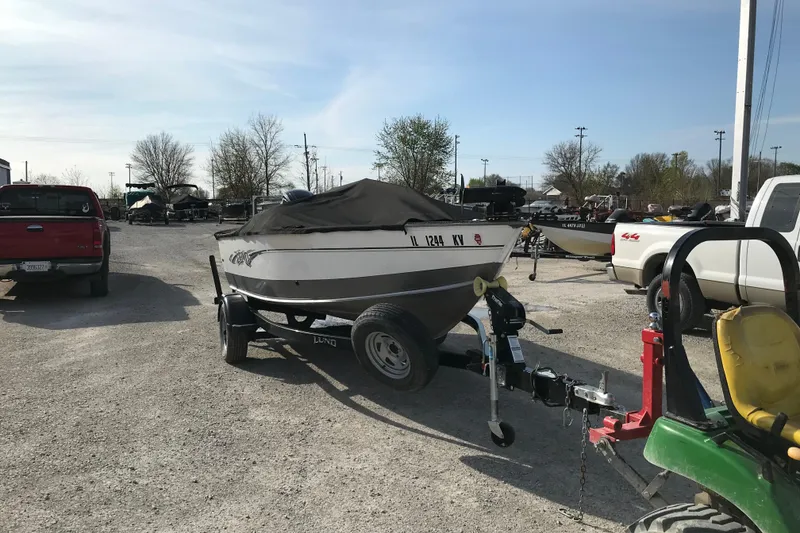 Slide: The Image of 2017 Lund 1775 Impact SS boat on trailer in parking lot. - 7