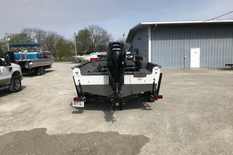 Slide: The Image of 2017 Lund 1775 Impact SS boat on trailer in parking lot. - 8