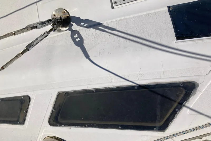 Slide: The Image of Close-up of 1987 Hunter Legend 35 sailboat deck with rigging and windows. - 11