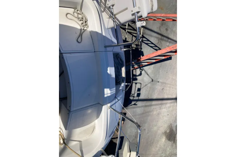 Slide: The Image of 1987 Hunter Legend 35 sailboat deck with ropes and railing in sunlight. - 12