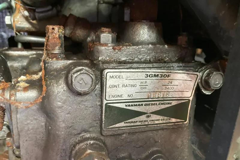 Slide: The Image of Yanmar diesel engine model 3GM30F, 24 HP, 3400 RPM, in a 1987 Hunter Legend 35. - 26