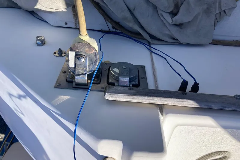 Slide: The Image of Deck fittings on a 1987 Hunter Legend 35 sailboat with blue wires and metal components. - 32