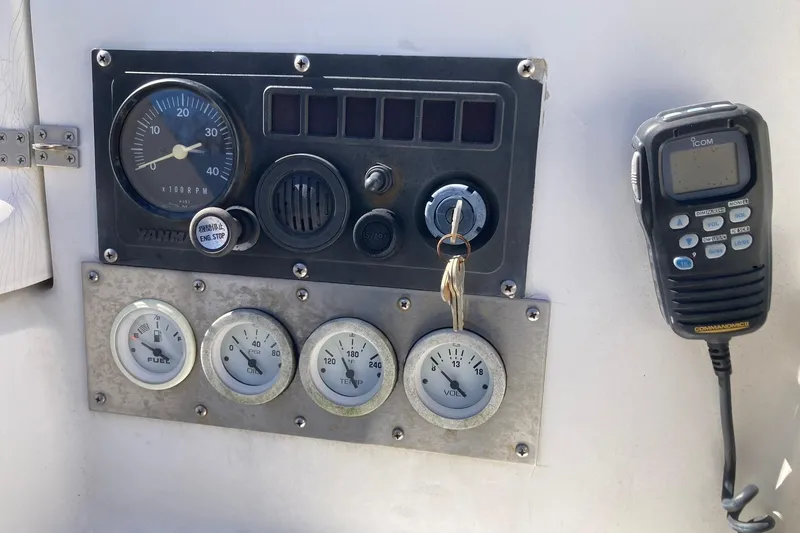 Slide: The Image of Control panel of a 1987 Hunter Legend 35 sailboat with gauges and radio. - 8