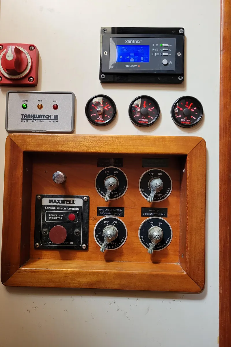 Slide: The Image of Control panel of a 1996 Little Harbor 51 Pilothouse with gauges and switches. - 49
