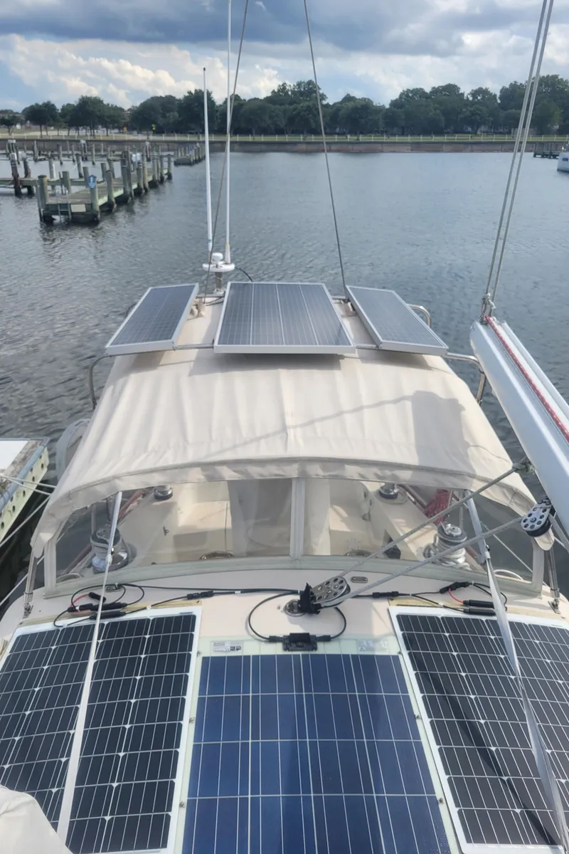 Slide: The Image of 1996 Little Harbor 51 Pilothouse with solar panels docked at a marina. - 11