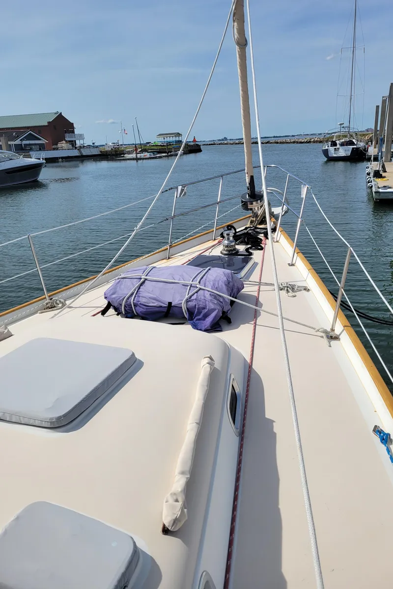 Slide: The Image of 1996 Little Harbor 51 Pilothouse yacht docked in a marina, view of the deck and bow. - 10