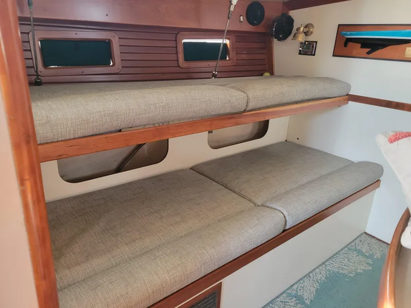 Slide: The Image of Interior of 1996 Little Harbor 51 Pilothouse with cozy bunk beds and wooden accents. - 38