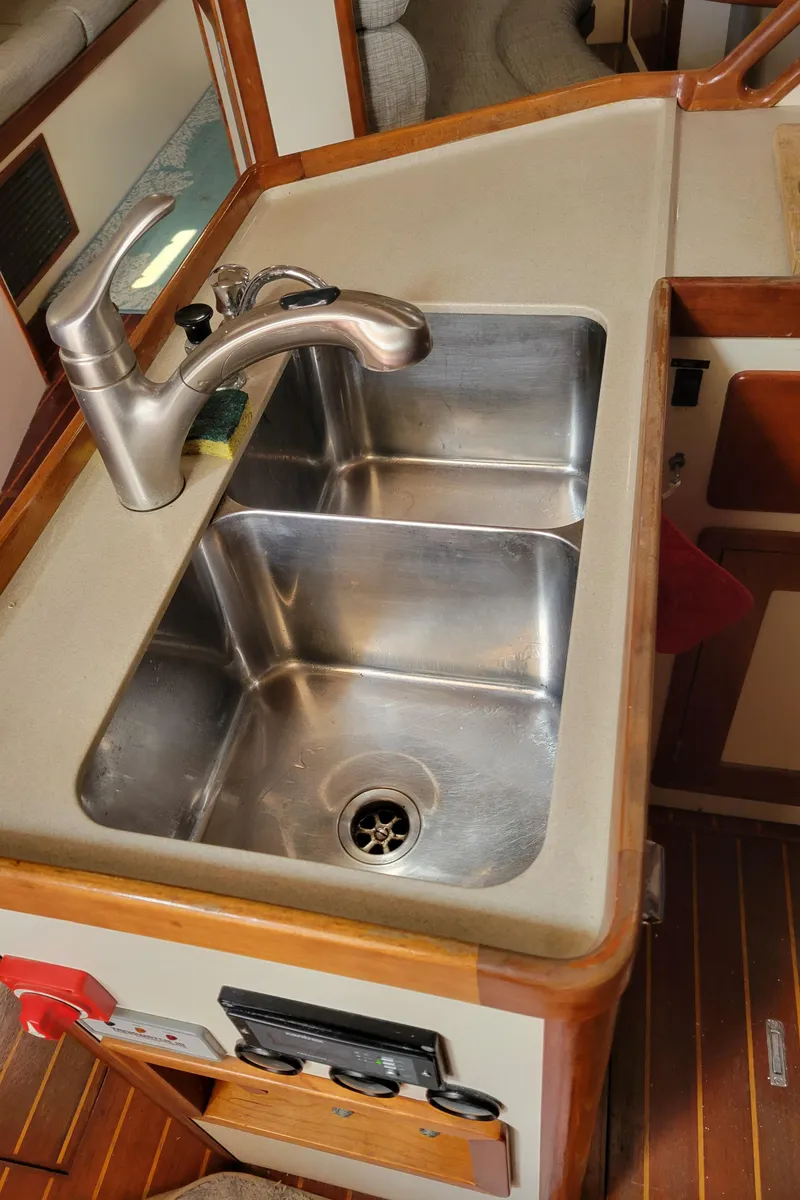 Slide: The Image of 1996 Little Harbor 51 Pilothouse kitchen sink with stainless steel basin and modern faucet. - 28