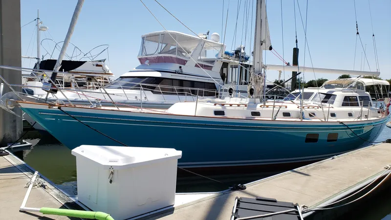 Slide: The Image of 1996 Little Harbor 51 Pilothouse yacht docked at marina, blue hull, sunny day. - 5