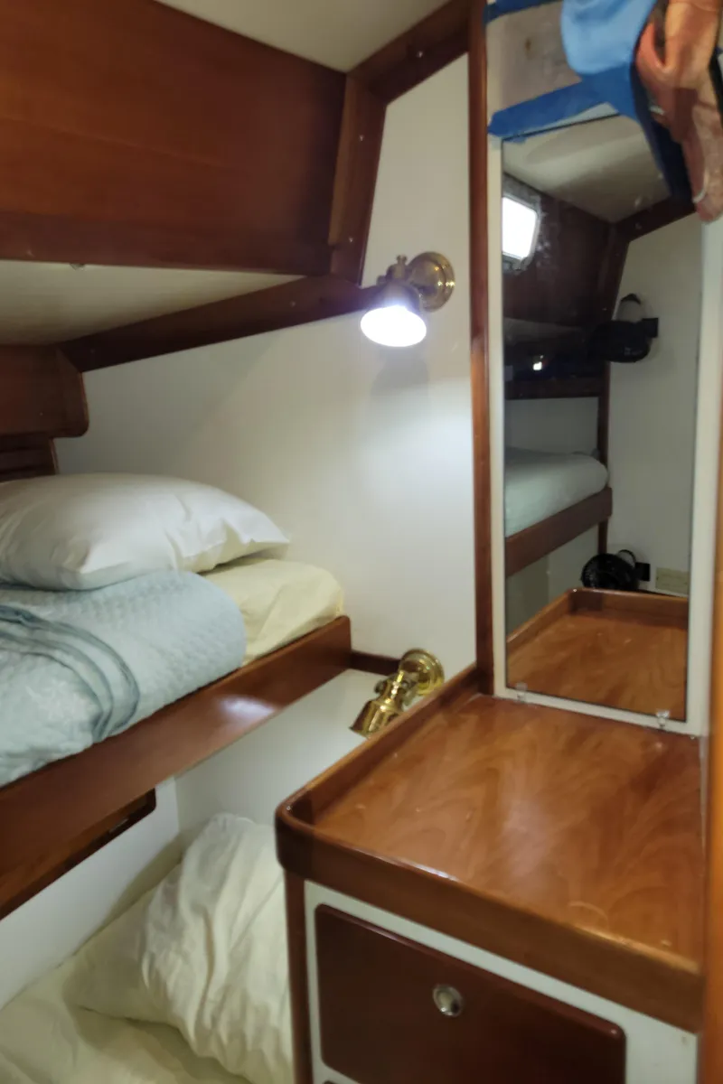 Slide: The Image of Cozy cabin interior of 1996 Little Harbor 51 Pilothouse with bunk beds and wooden furnishings. - 39