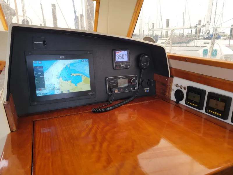 Slide: The Image of 1996 Little Harbor 51 Pilothouse navigation console with GPS and communication equipment. - 21