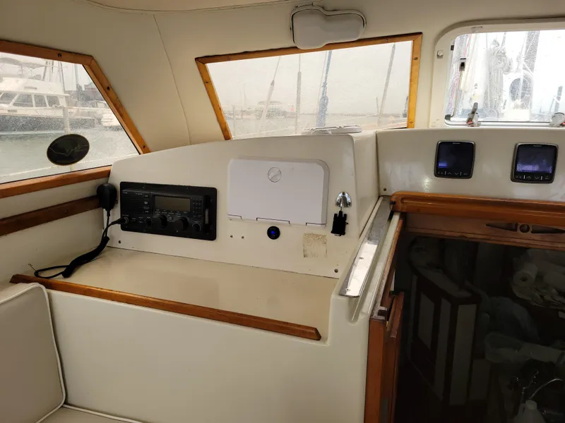 Slide: The Image of Interior of 1996 Little Harbor 51 Pilothouse with navigation equipment and wooden accents. - 23