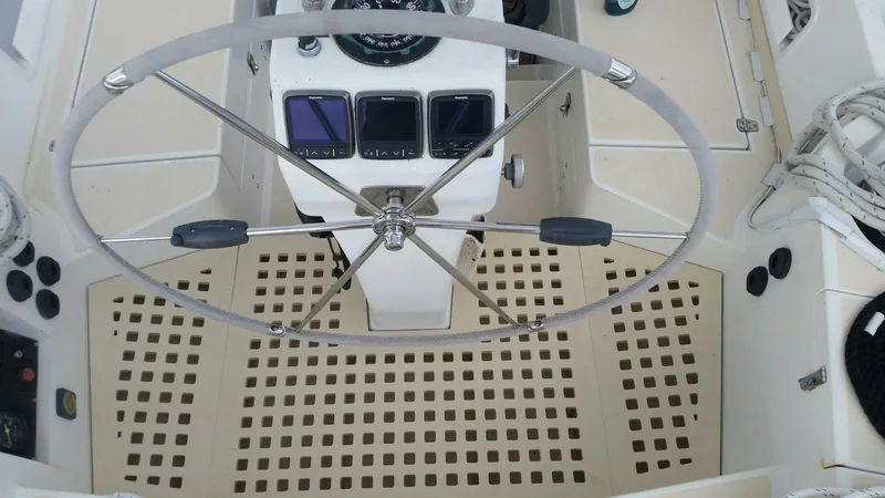 Slide: The Image of Steering wheel and controls of a 1996 Little Harbor 51 Pilothouse yacht. - 14