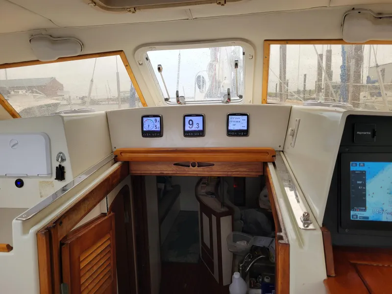 Slide: The Image of Interior view of 1996 Little Harbor 51 Pilothouse with navigation instruments and wooden cabinetry. - 20