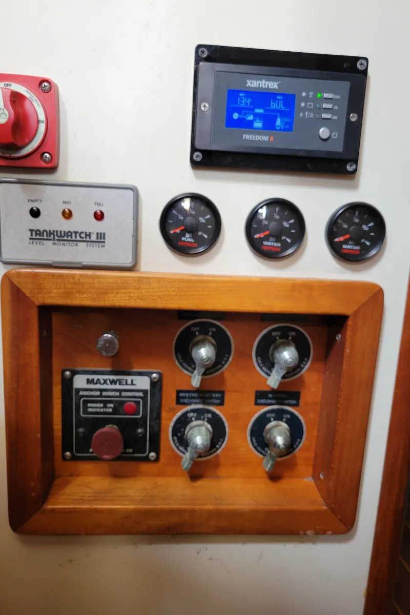 Slide: The Image of Control panel of a 1996 Little Harbor 51 Pilothouse yacht with gauges and switches. - 48