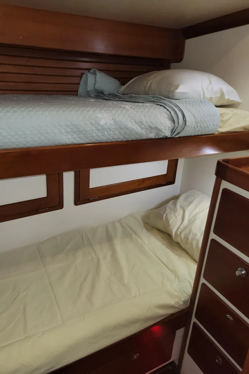 Slide: The Image of Bunk beds in a 1996 Little Harbor 51 Pilothouse yacht cabin with wooden accents. - 40