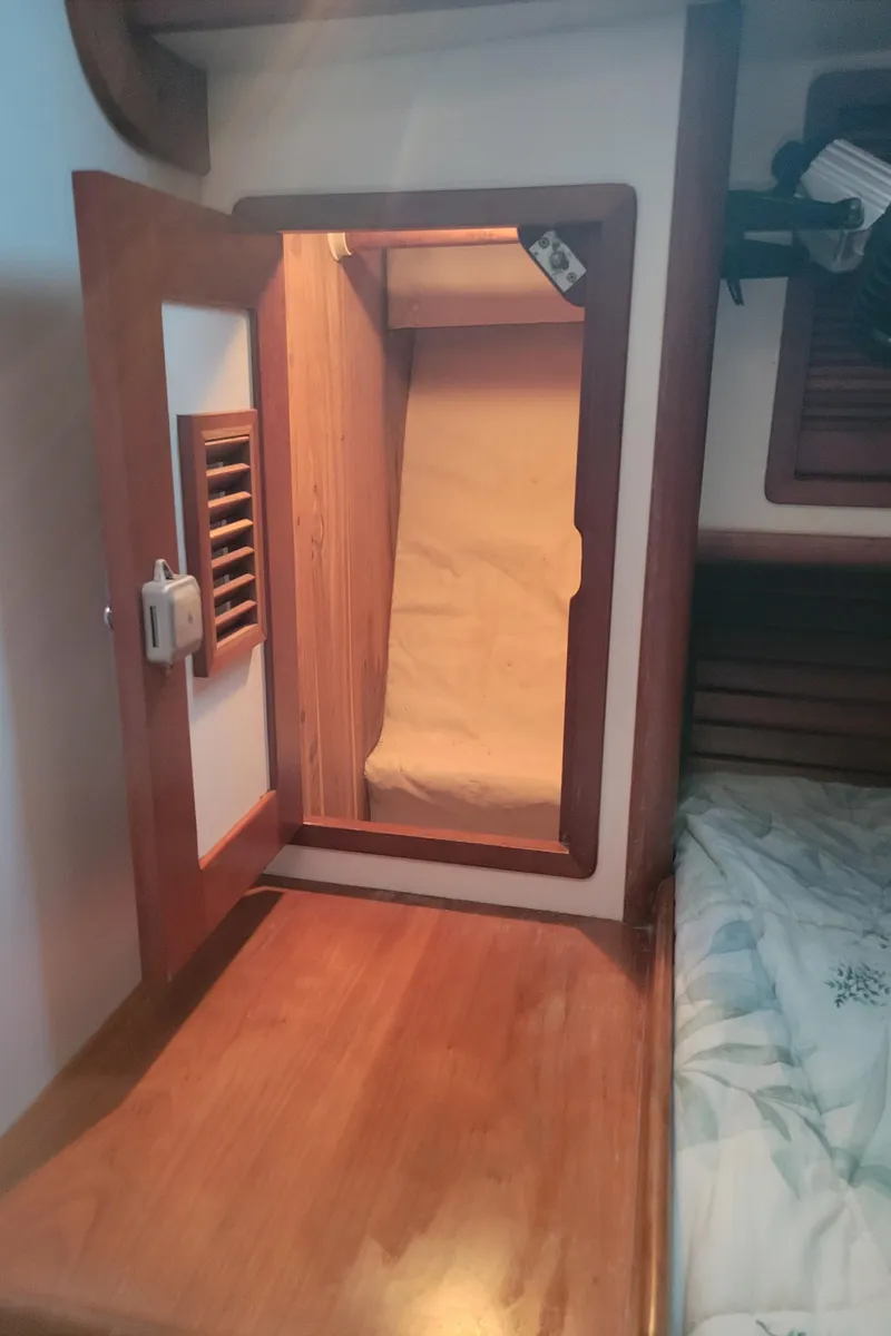 Slide: The Image of 1996 Little Harbor 51 Pilothouse cabin interior with wooden storage compartment. - 35