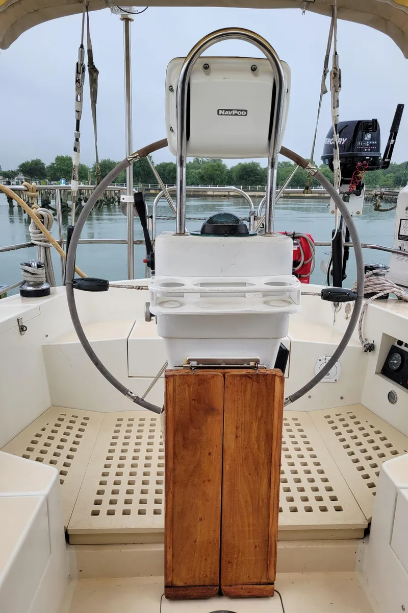 Slide: The Image of Helm of 1996 Little Harbor 51 Pilothouse yacht with steering wheel and NavPod. - 13