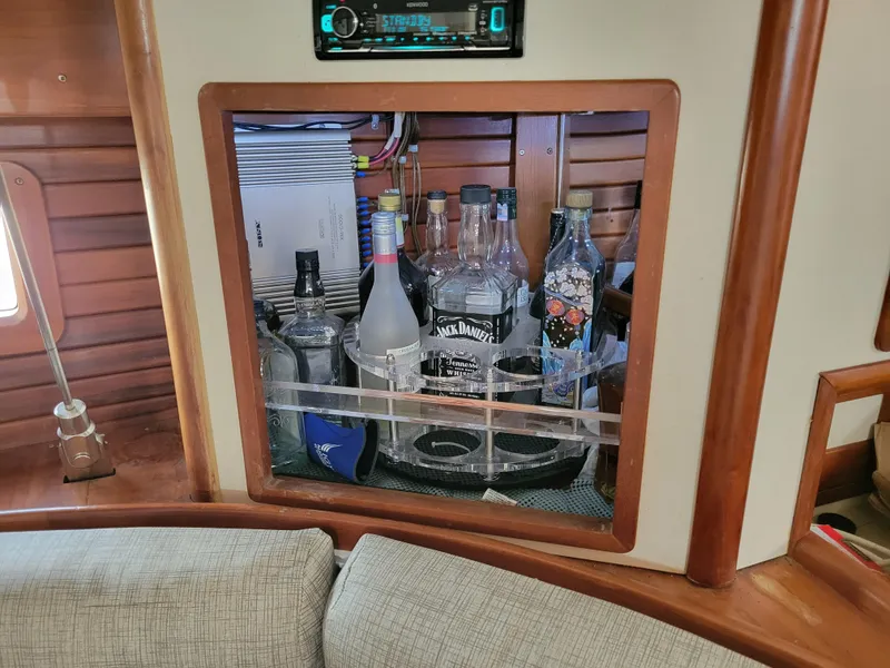 Slide: The Image of Bar area inside 1996 Little Harbor 51 Pilothouse yacht with assorted liquor bottles. - 32
