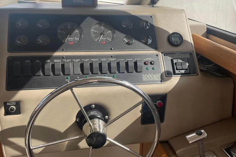 Slide: The Image of 2001 Bayliner 3388 Command Bridge Motoryacht helm with gauges and controls. - 23