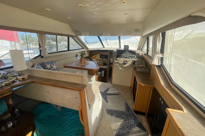 Slide: The Image of 2001 Bayliner 3388 Command Bridge Motoryacht interior with helm, seating, and panoramic windows. - 27