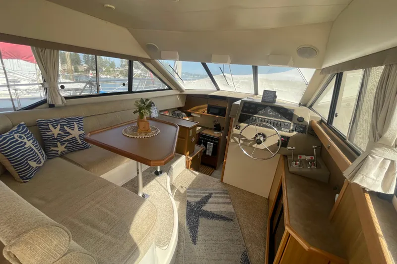 Slide: The Image of Interior of 2001 Bayliner 3388 Command Bridge Motoryacht with helm, seating, and nautical decor. - 28