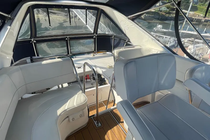 Slide: The Image of 2001 Bayliner 3388 Command Bridge Motoryacht interior with seating and helm station. - 34