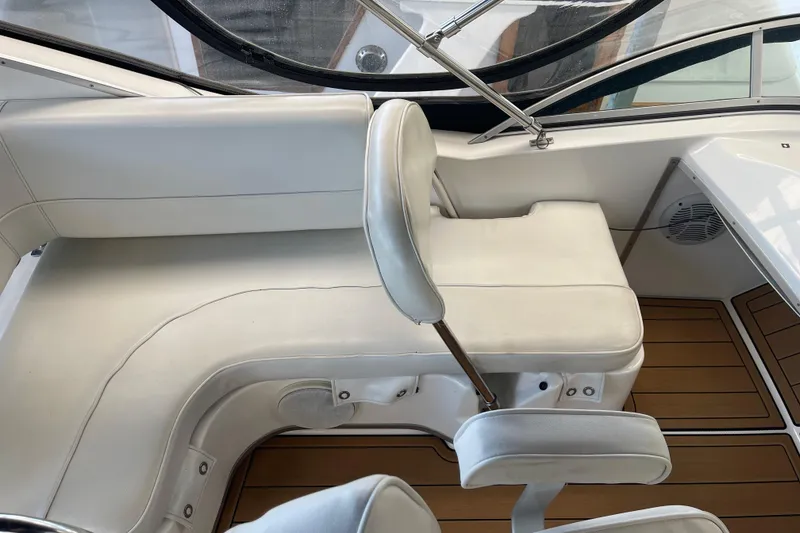 Slide: The Image of 2001 Bayliner 3388 Command Bridge Motoryacht interior with white seating and wood flooring. - 41