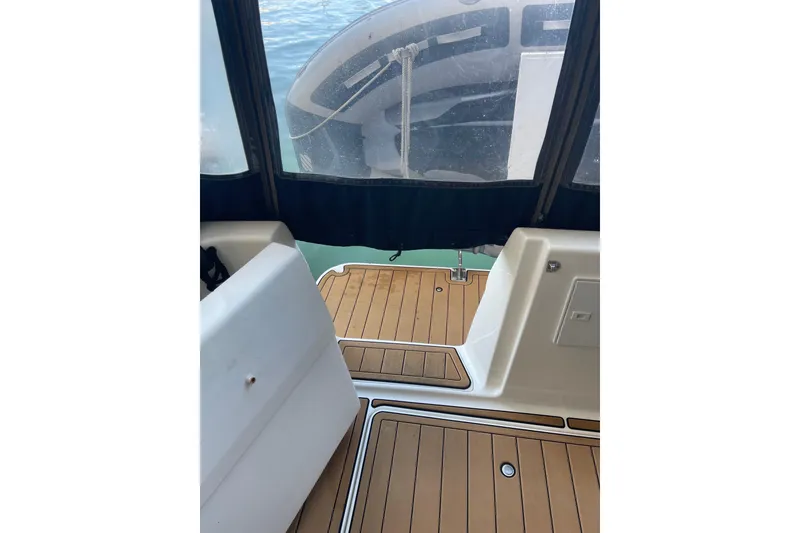Slide: The Image of 2001 Bayliner 3388 Command Bridge Motoryacht interior with teak flooring and view of water. - 52