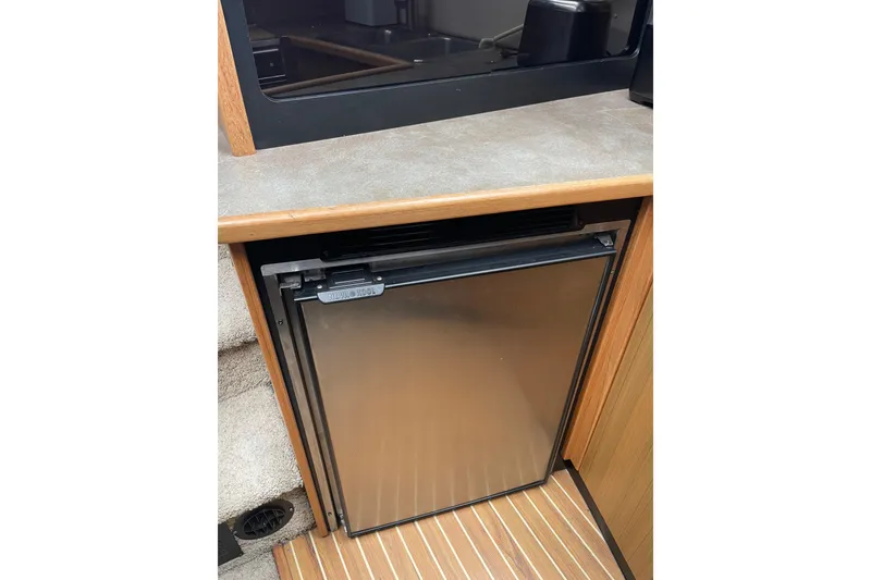 Slide: The Image of Compact refrigerator in 2001 Bayliner 3388 Command Bridge Motoryacht interior. - 54
