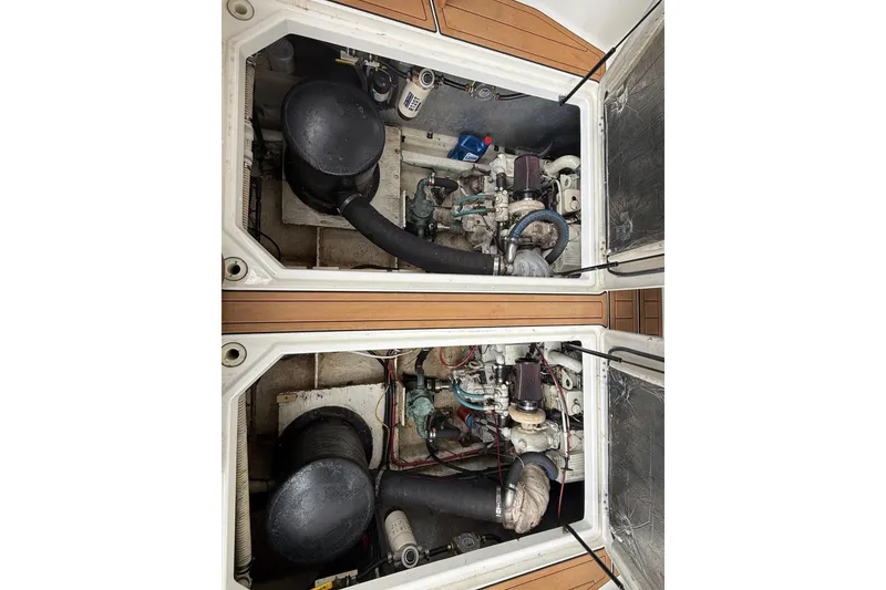 Slide: The Image of Engine compartment of 2001 Bayliner 3388 Command Bridge Motoryacht, showcasing dual engines. - 66