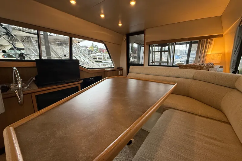 Slide: The Image of Interior of 2001 Bayliner 3388 Command Bridge Motoryacht with spacious seating and large windows. - 72