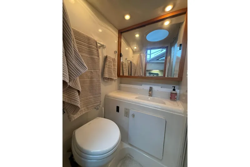 Slide: The Image of Bathroom interior of 2001 Bayliner 3388 Command Bridge Motoryacht with sink and mirror. - 75