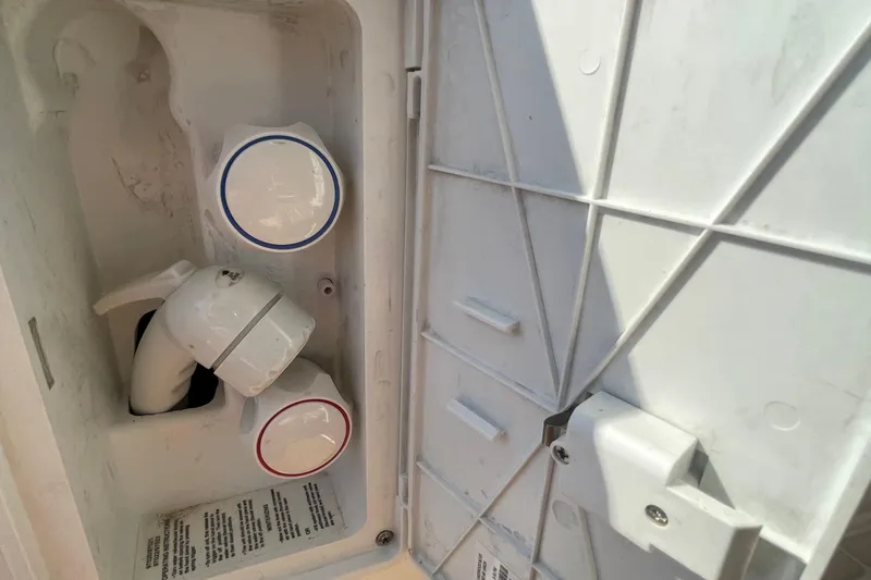 Slide: The Image of 2001 Bayliner 3388 Command Bridge Motoryacht water control panel with hot and cold knobs. - 8