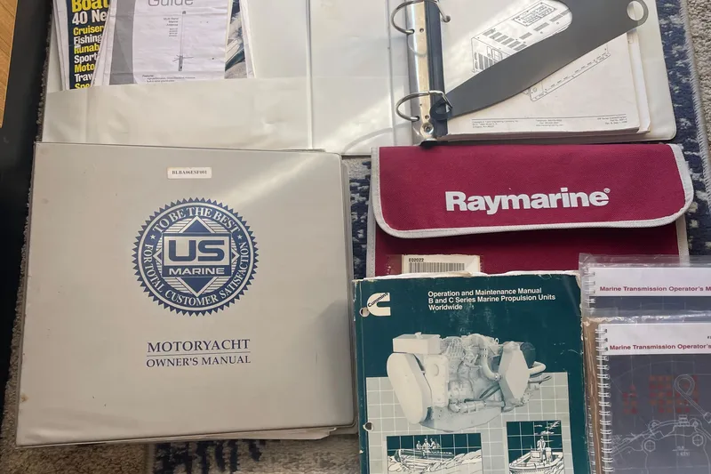 Slide: The Image of Collection of manuals for 2001 Bayliner 3388 Command Bridge Motoryacht, including Raymarine and Cummins guides. - 9