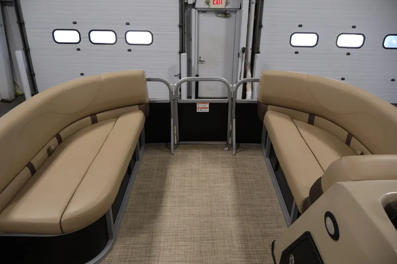 Slide: The Image of 2022 Harris Cruiser LX180 Cruise interior with beige seating and carpeted floor. - 12
