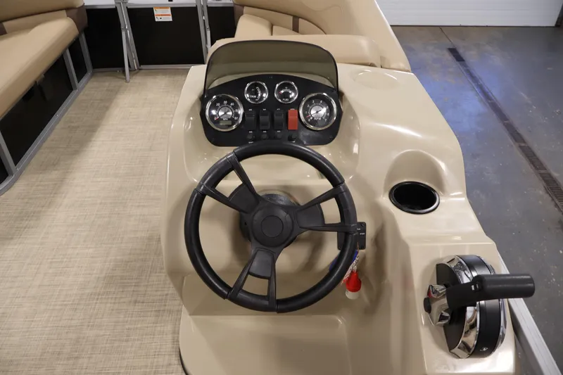 Slide: The Image of 2022 Harris Cruiser LX180 Cruise boat dashboard with steering wheel and controls. - 17