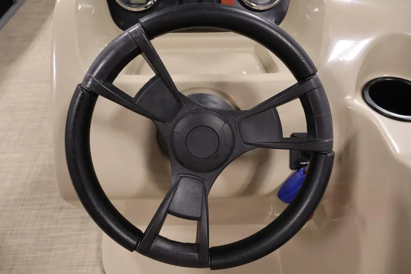 Slide: The Image of Steering wheel of 2022 Harris Cruiser LX180 Cruise boat, featuring a sleek design. - 18