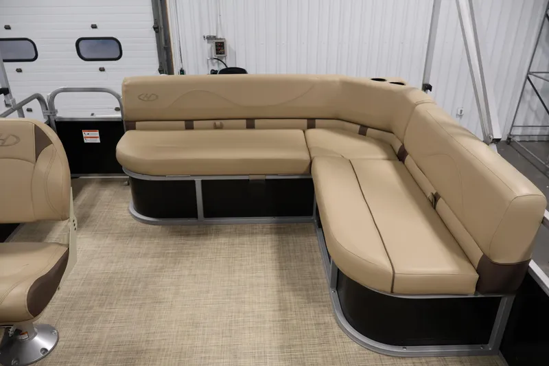 Slide: The Image of 2022 Harris Cruiser LX180 Cruise boat interior with beige seating and modern design. - 22