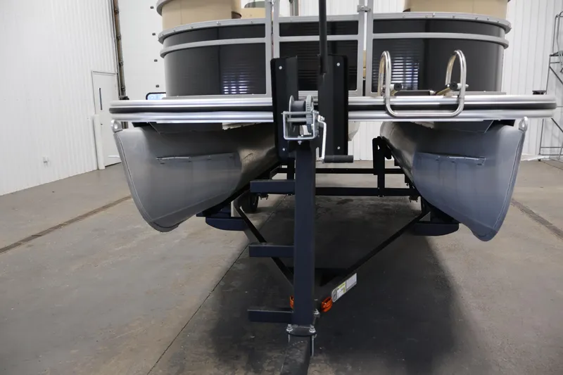 Slide: The Image of 2022 Harris Cruiser LX180 Cruise pontoon boat on trailer in indoor storage. - 31