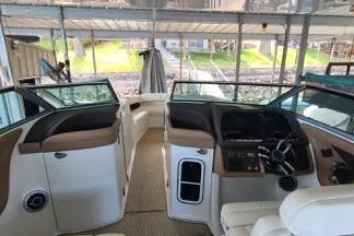 Slide: The Image of Luxurious interior of a 2017 Cobalt R35 boat with plush seating and a scenic dock view. - 12