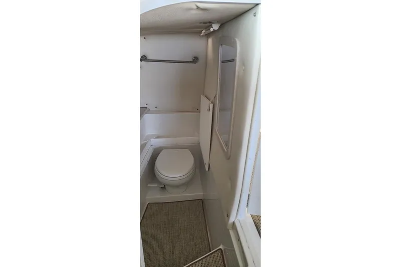 Slide: The Image of 2017 Cobalt R35 boat bathroom with sink, toilet, and mirror. - 17
