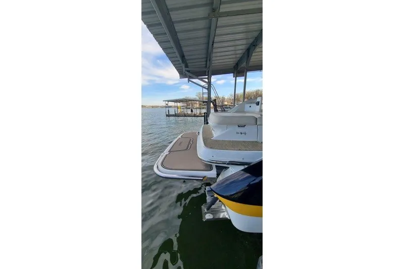 Slide: The Image of 2017 Cobalt R35 boat interior bathroom with modern lighting and compact design. - 18