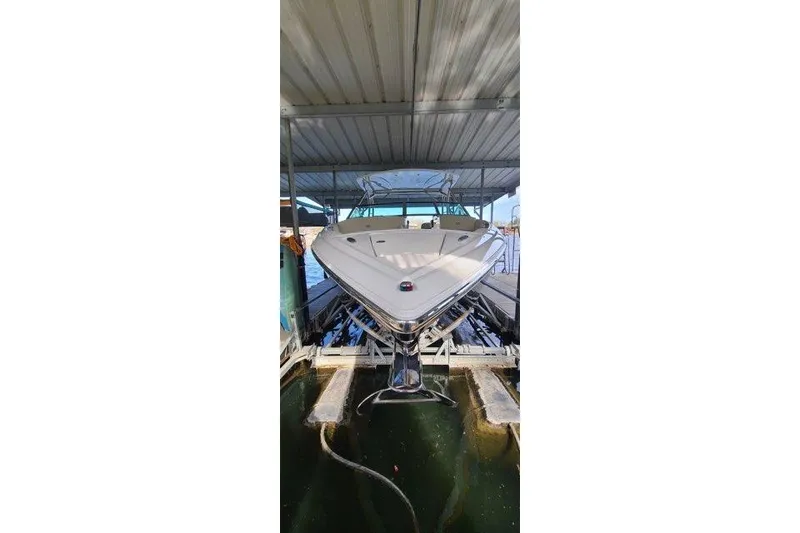 Slide: The Image of 2017 Cobalt R35 boat propellers submerged in water at a dock. - 19