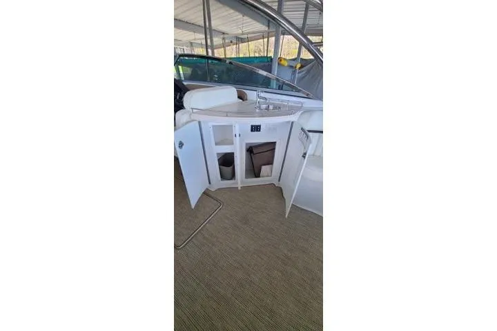 Slide: The Image of Rear view of a 2017 Cobalt R35 boat with stainless steel trim tabs. - 20