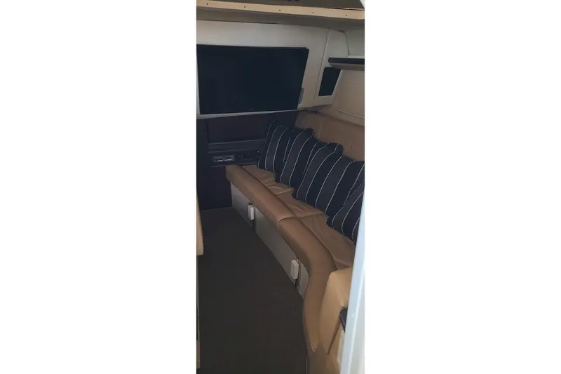 Slide: The Image of 2017 Cobalt R35 boat docked under a metal canopy. - 22