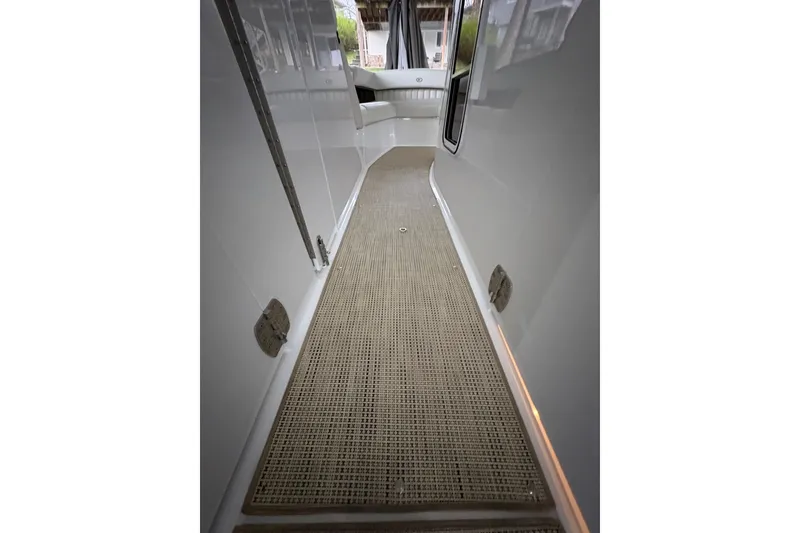 Slide: The Image of 2017 Cobalt R35 boat deck with sleek white finish and textured flooring. - 24