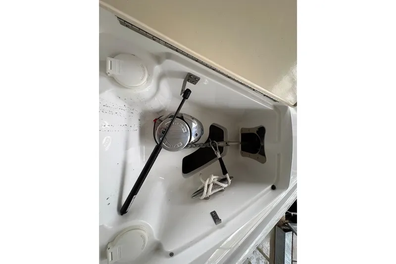 Slide: The Image of 2017 Cobalt R35 boat anchor compartment with rope and winch system. - 26