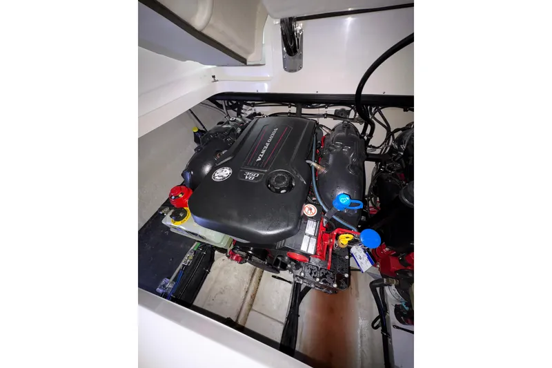 Slide: The Image of Engine compartment of a 2017 Cobalt R35 boat, featuring a Volvo Penta engine. - 31