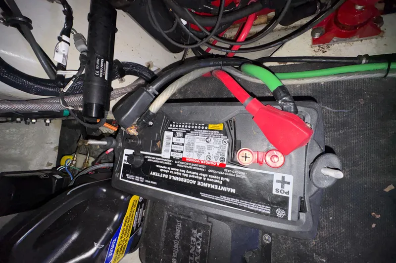 Slide: The Image of Battery compartment of a 2017 Cobalt R35 with visible wiring and connections. - 33